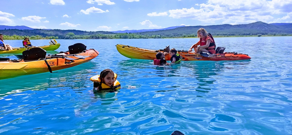 Kayaking in the turquoise waters of the Pyrenees by Living Tours